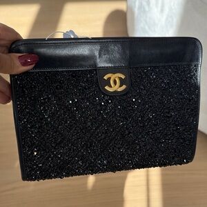 CHANEL Black Beaded Pouch with Gold Logo
